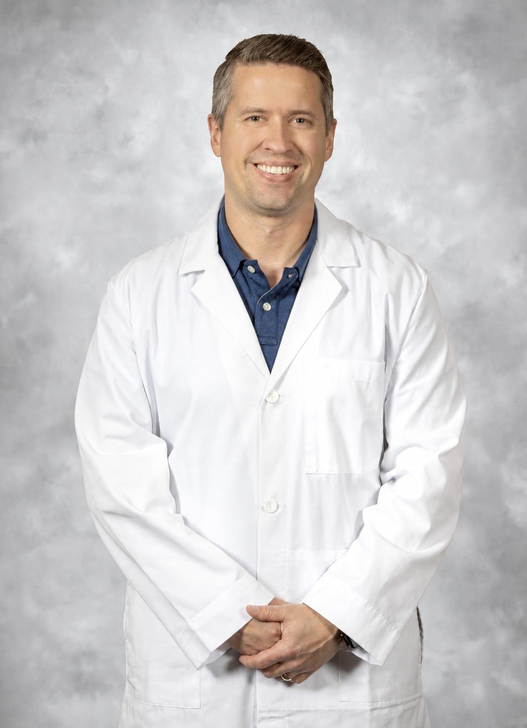 Portrait of Dr. Ryan Blackwell in a white coat.
